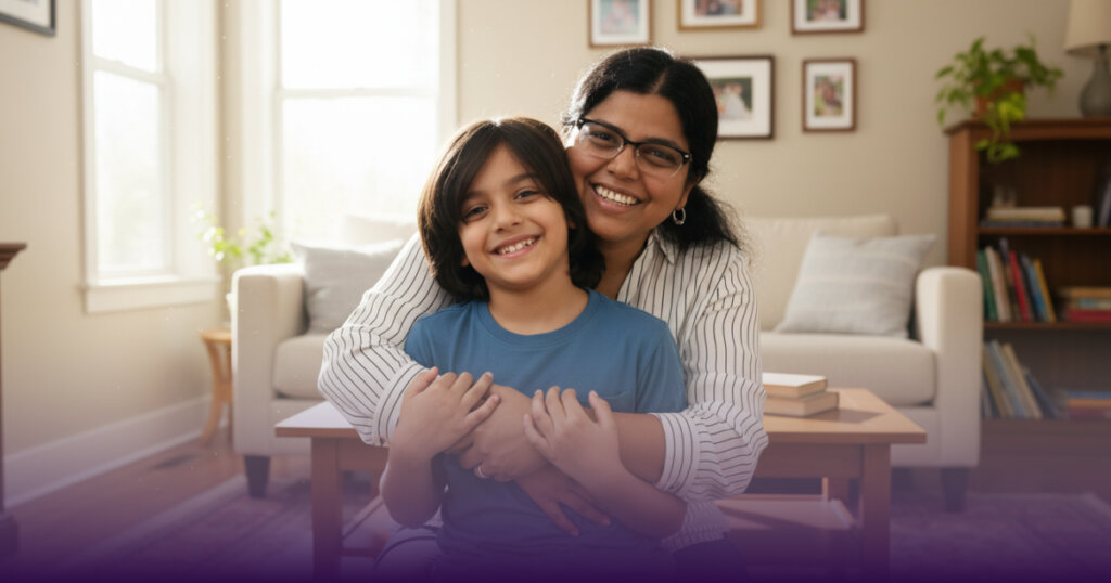 A mother cuddle her child with a smile on face.